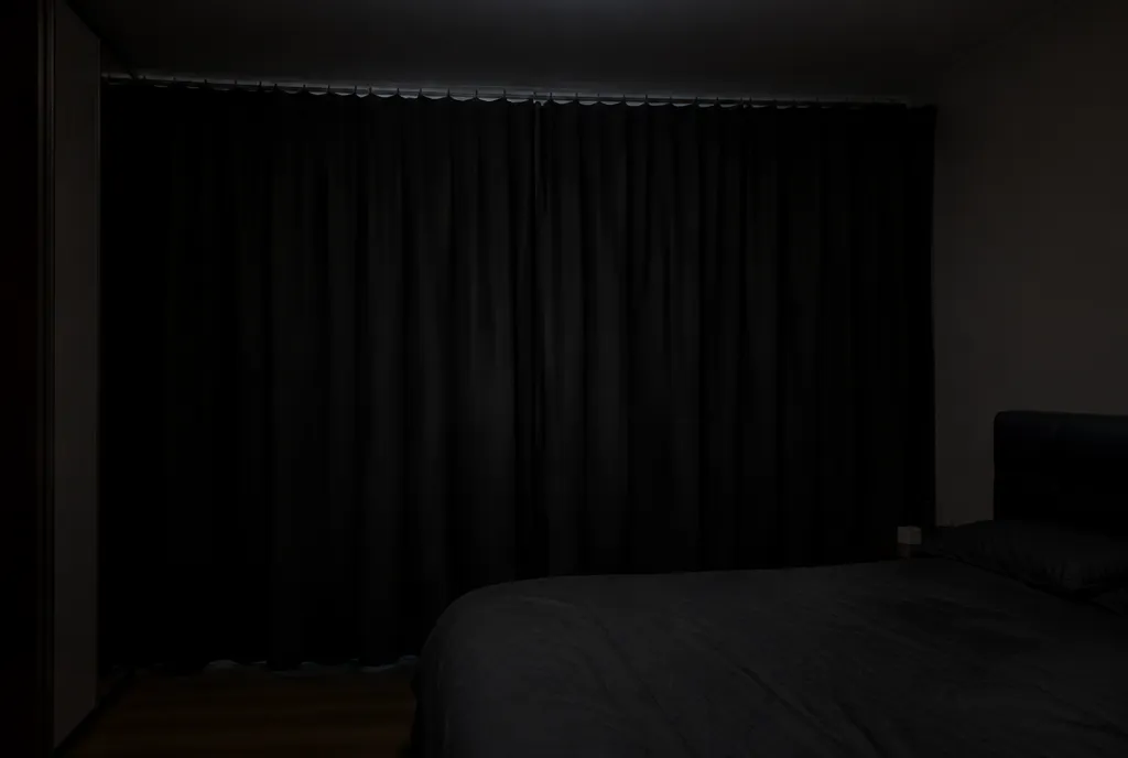 Blackout curtains overlapping well past the window frame.