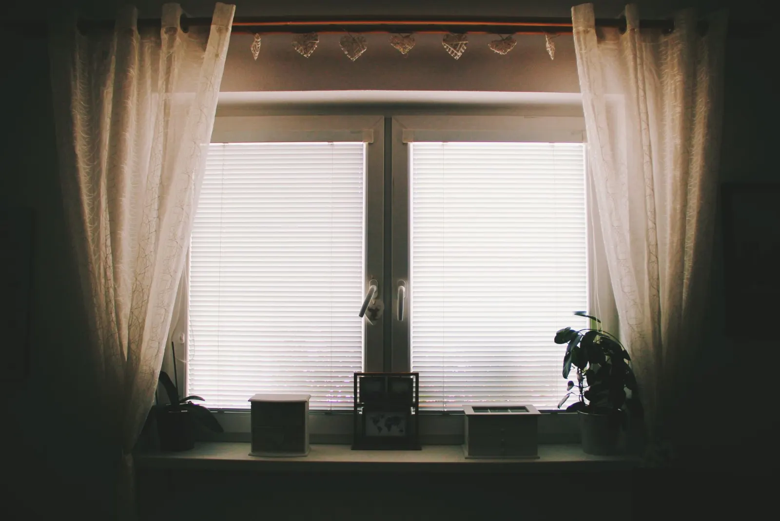 Curtains fitted around a bedroom window