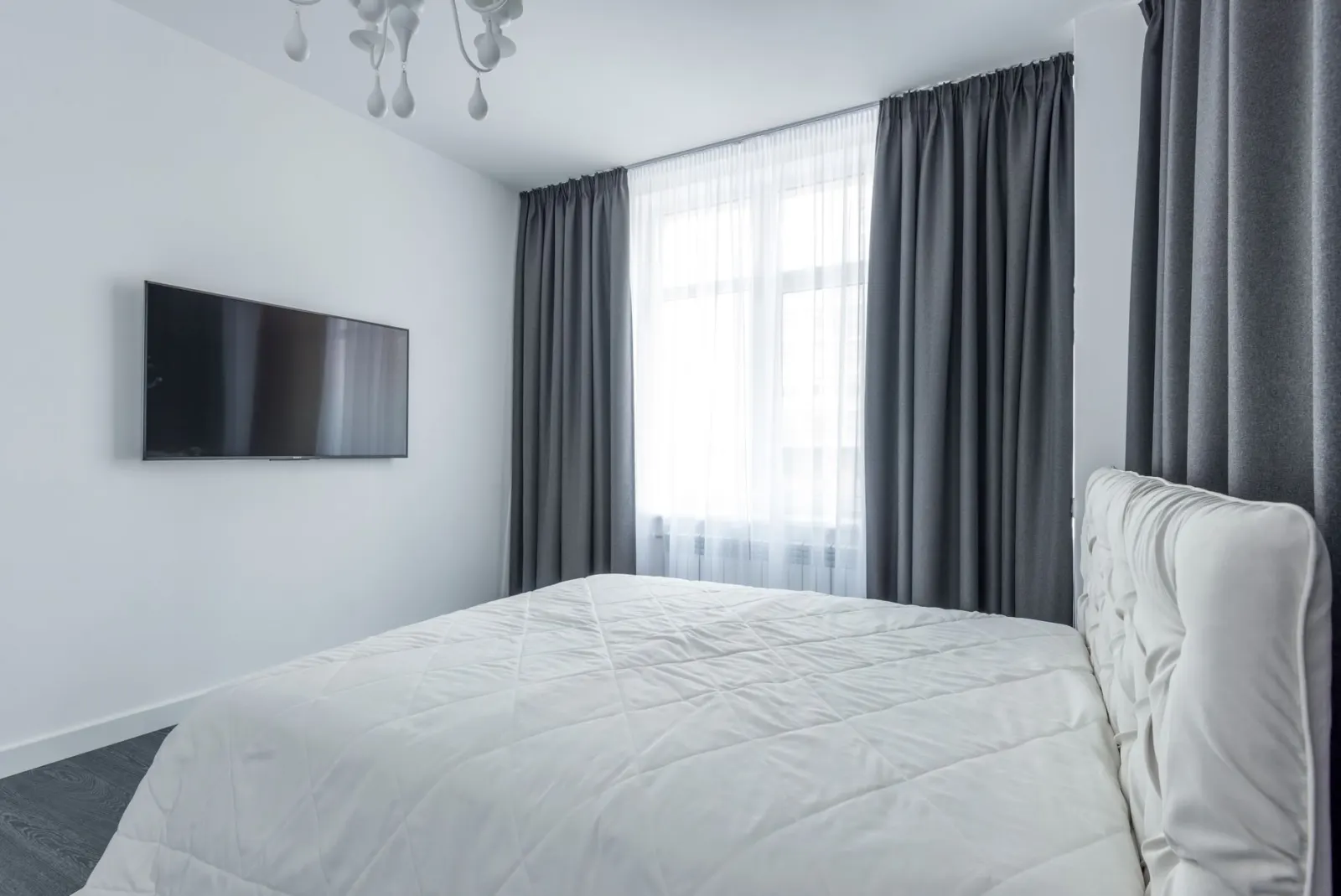 Curtains fitted around a bedroom window